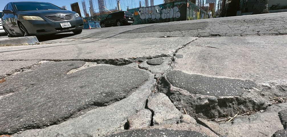LA pothole compensation issue shown by deep pothole on Western Avenue near 4th Street in Koreatown