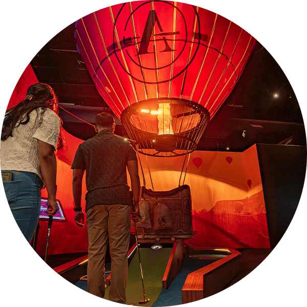 Hot air balloon model displayed indoors at Premier Putting event.