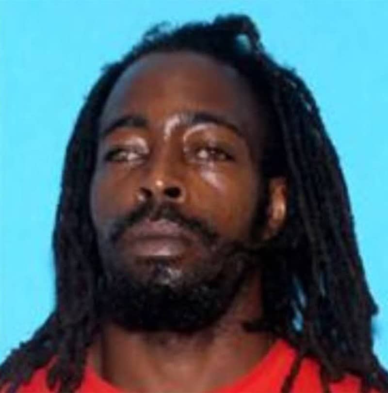 Mugshot of Adrian Dabney, convicted in Lee County, Alabama, for child sex crimes. Dabney, with dreadlocks and a goatee, faces forward against a blue background. The Lee County District Attorney's Office prosecuted the case.