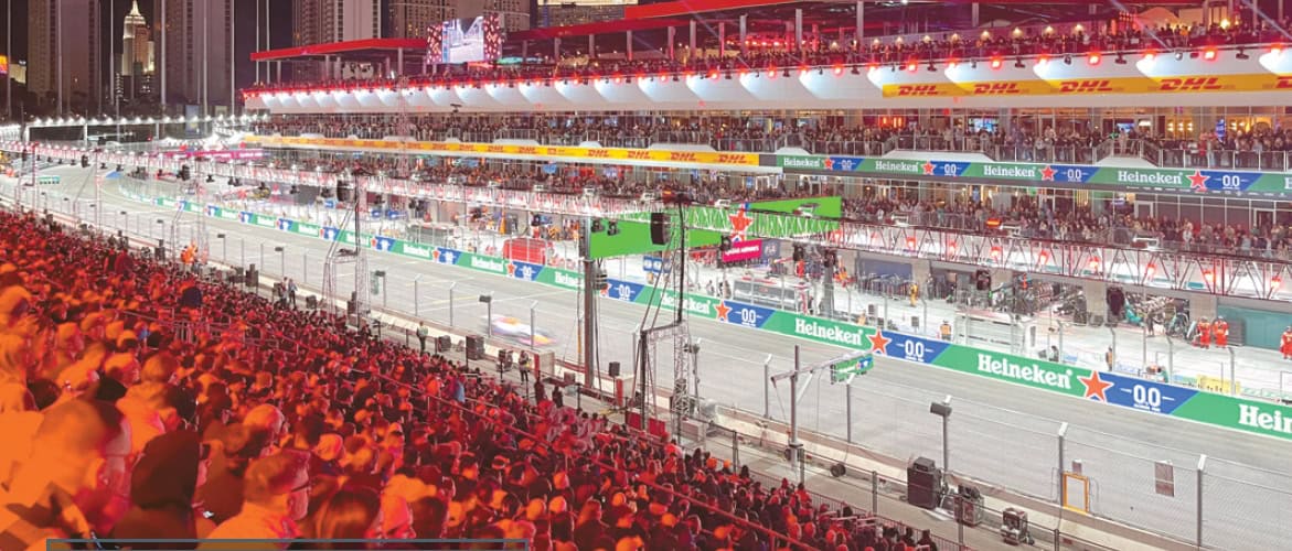 Spectators watch Formula One cars racing through the Las Vegas street circuit during the 2025 F1 Las Vegas Grand Prix on November 22