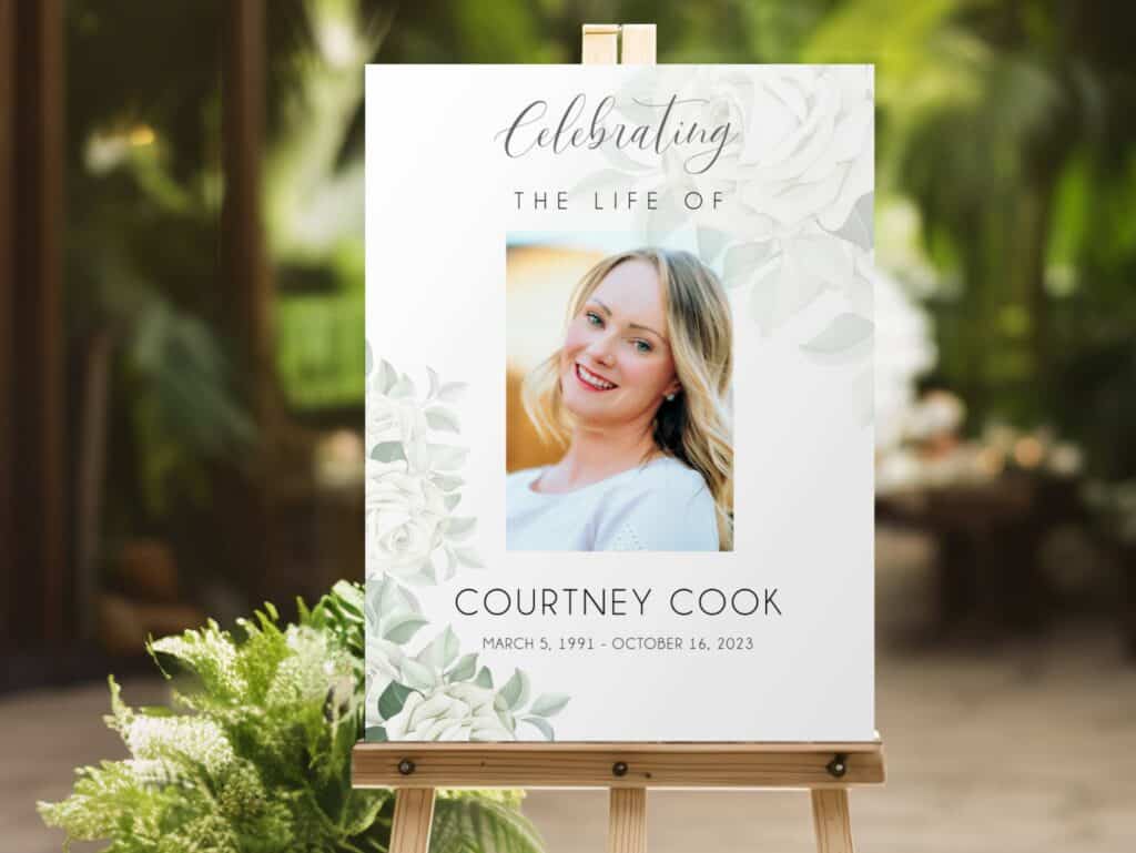 Funeral sign board printed with white roses and photo