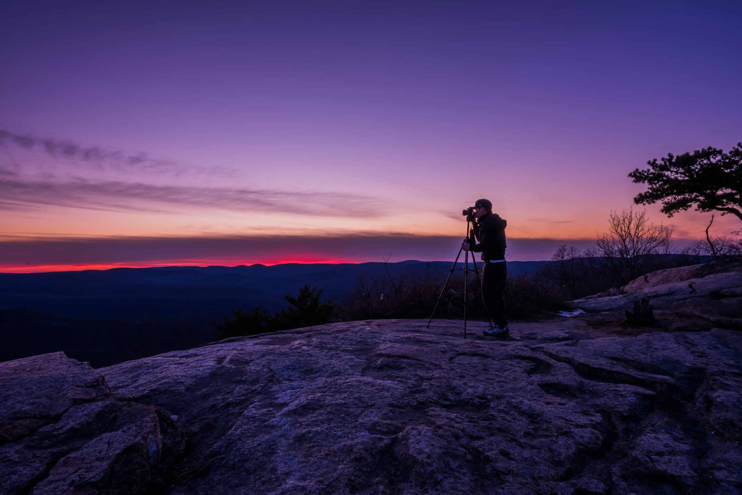 How to Shoot Panoramas with Canon EOS 6D / 6D Mark II & Sony FE 16-35mm f/2.8 GM 15 Man Taking a Photo Using Camera With Tripod for panorama