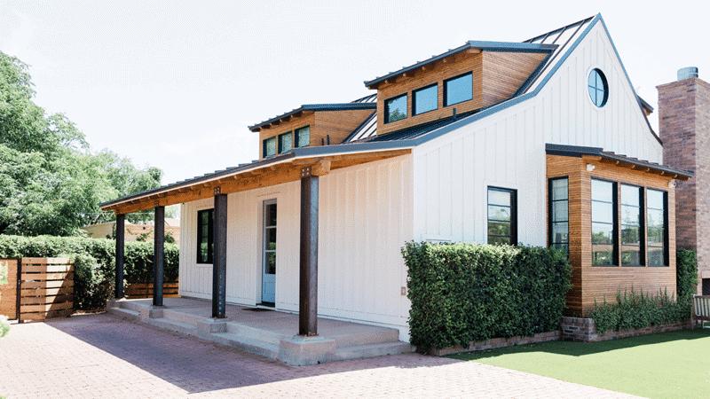 Exterior of White Home with Natural Wood Trim / Top 6 Essential Home Improvement Tips for Timeless enhancements