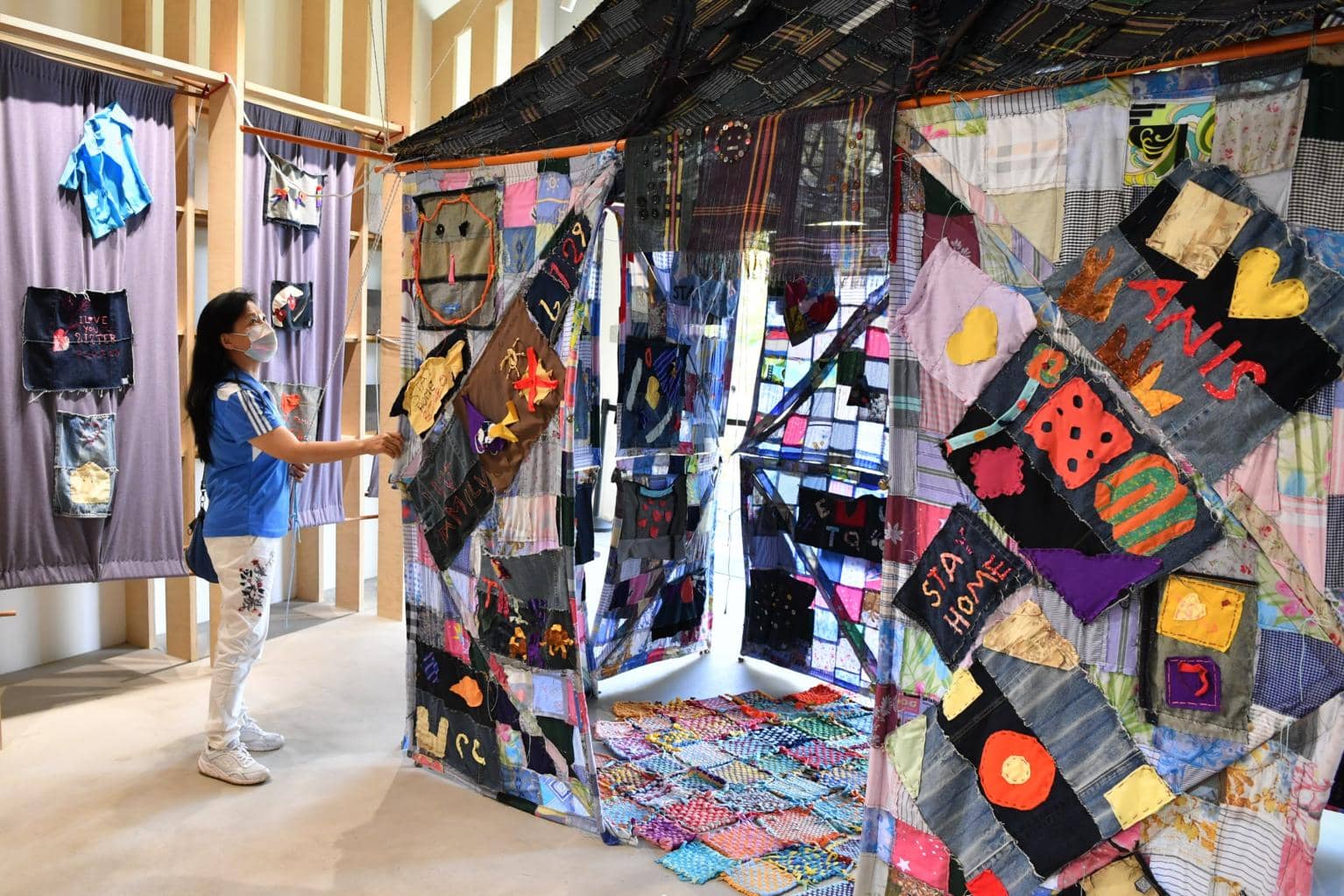 A visitor looking at the Stay Home Quilt at the Tzu Chi Humanistic Youth Centre on Dec 27, 2020. ST PHOTO: CHONG JUN LIANG