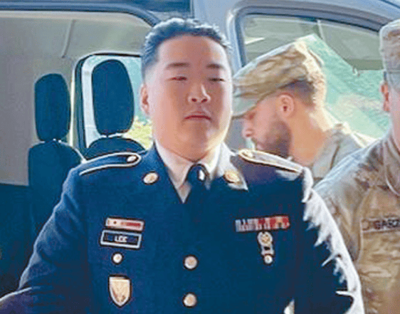 Korean American soldier Jonathan Kang Lee enters military court in handcuffs