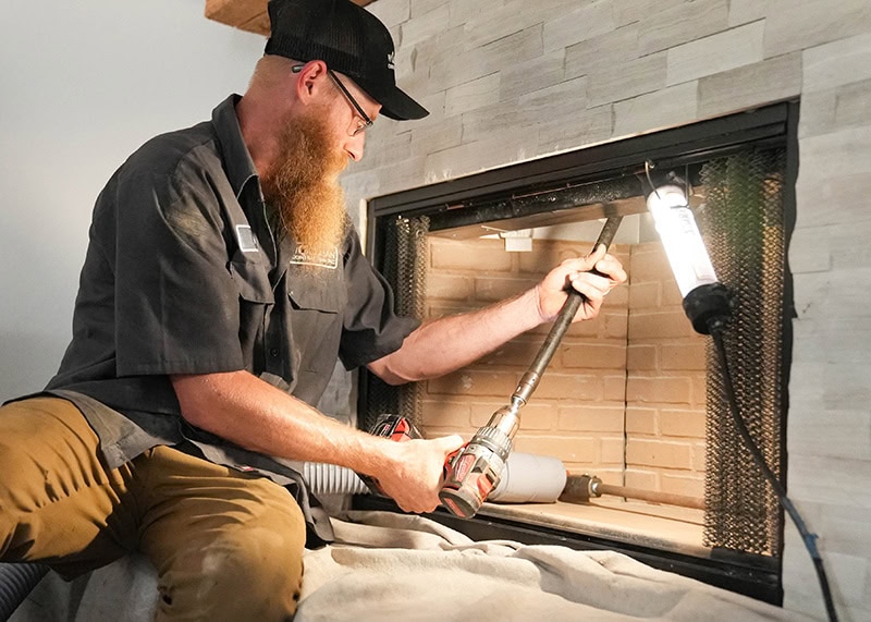 Chimney Technician inspecting the chimney