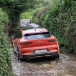 A car parked on the side of a river