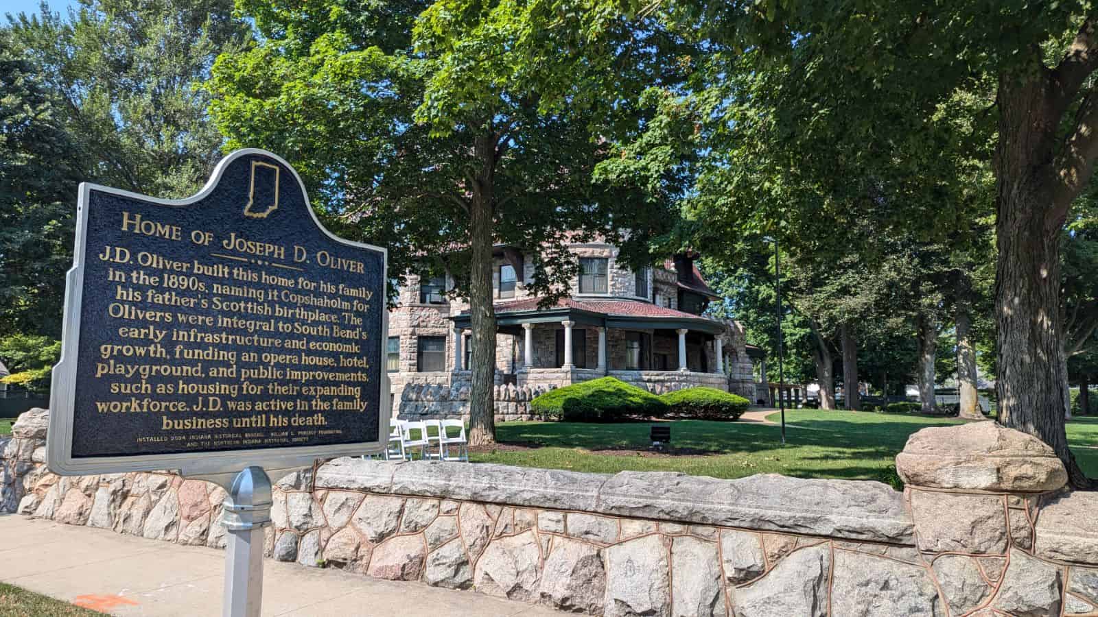 jdmarker Historic house museum of Joseph D. Oliver surrounded by lush green trees in South Bend.