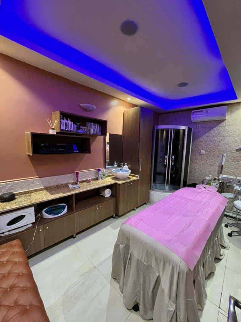 Modern spa treatment room with massage table