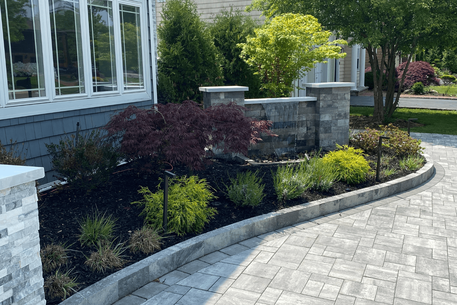 Well-maintained garden with stone features