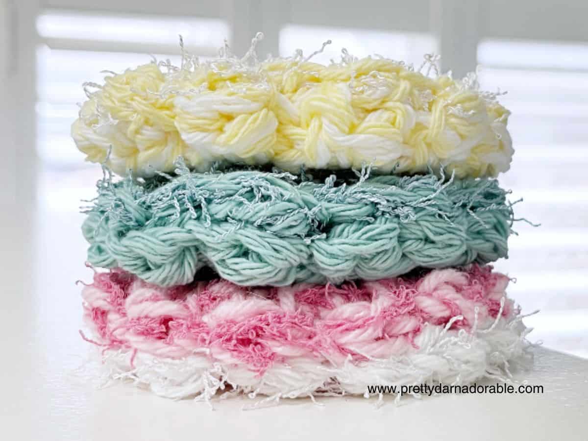 stack of crochet scrubby rounds in different colours