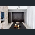 A room with a fireplace and a large window