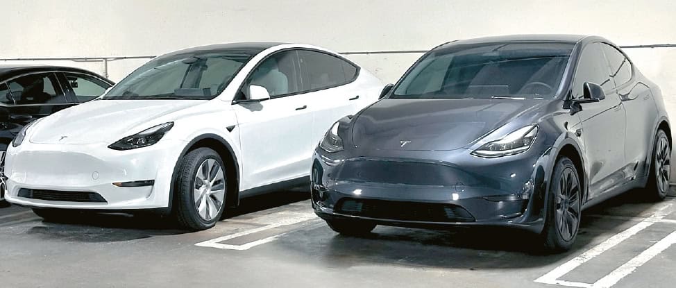 Two Tesla Model Y vehicles parked as Tesla rolls out major discounts ahead of the redesigned model's release.