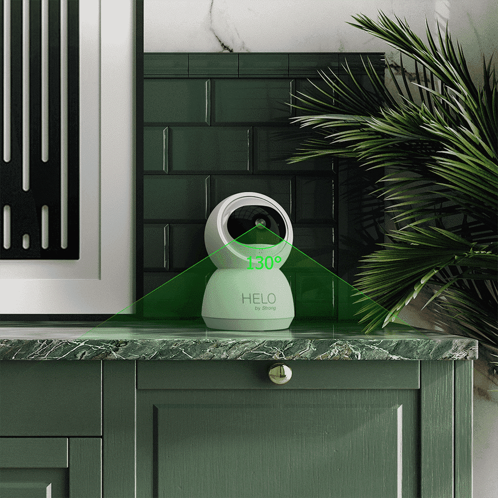 Appareil de surveillance intelligemment positionné sur un meuble en vert foncé avec un rayon de détection de 130° pour la sécurité domestique.