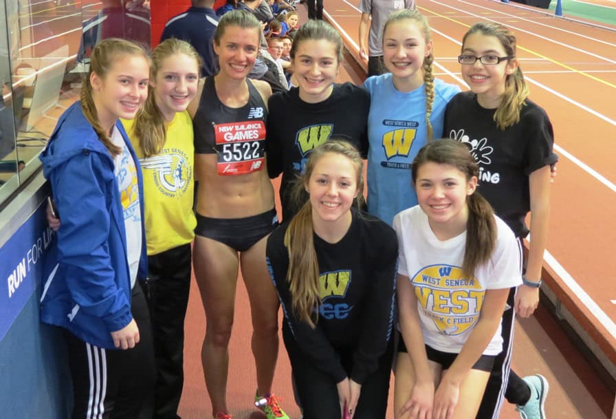 PHOTO: Kim Conley poses with the girls track team of West Seneca West schools (West Seneca, N.Y.) after winning the 2016 New Balance Games invitational mile (photo by David Monti for Race Results Weekly)