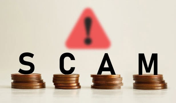 Image showing the word "scam," symbolizing Ponzi scheme fraud