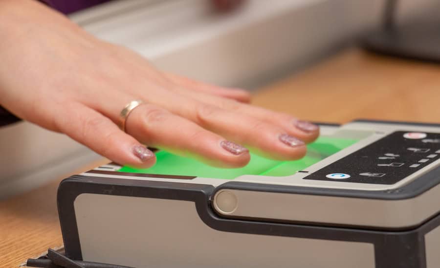 USCIS biometric data expansion fingerprint scanning process at a border checkpoint