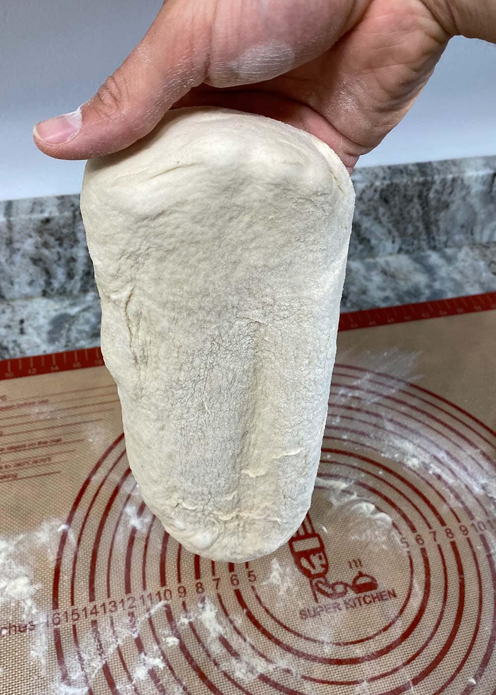 Letting pizza dough form