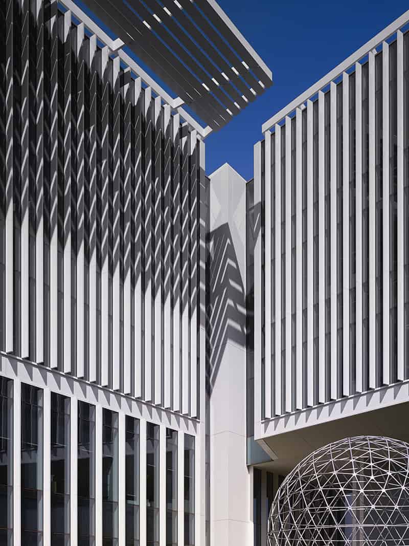 Corner view of Chesapeake Building 15 showcasing the upper-level glass detail where the building turns.