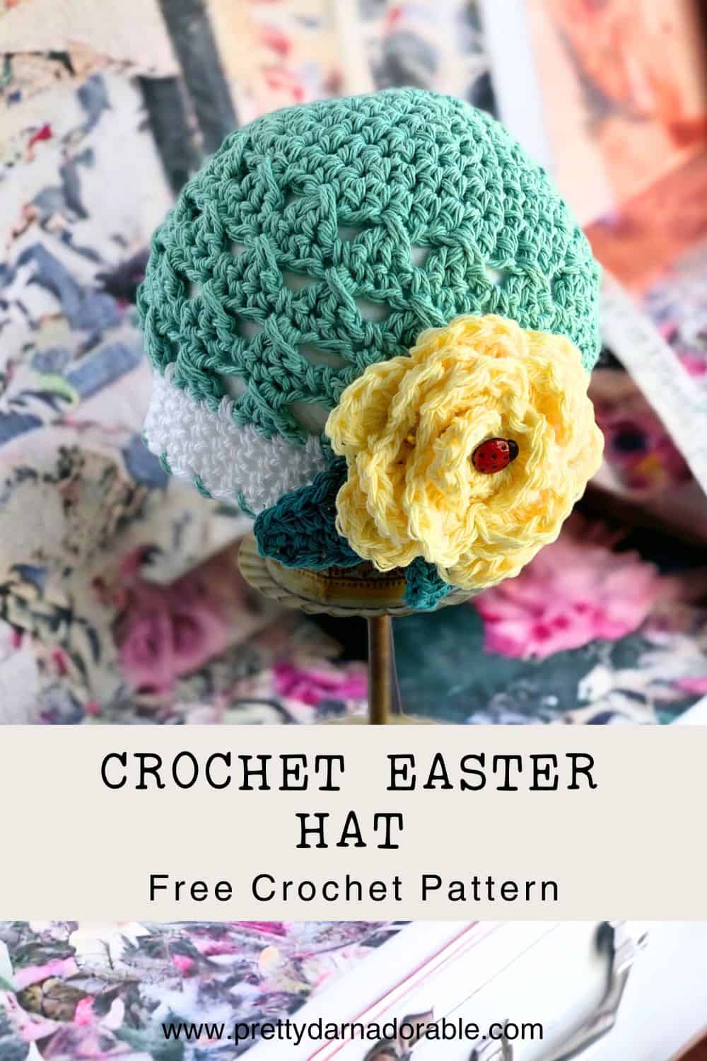 aqua crochet beanie with white trim and rose on a baby. free crochet baby hat pattern