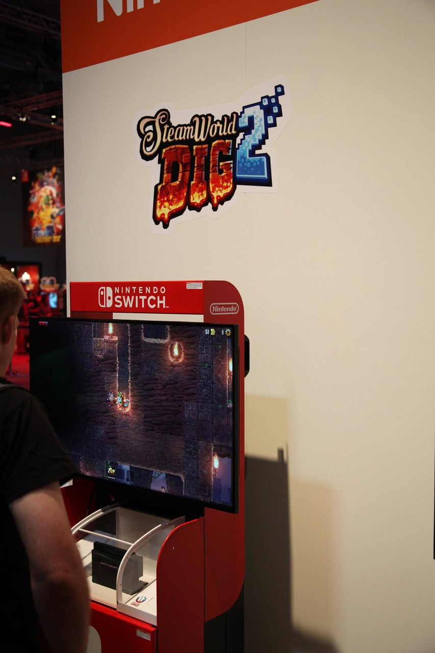 "Station de jeu Nintendo Switch avec jeu vidéo Dungeon Fighter Online 2 lors de l'événement Air-Gaming, parfait pour les amateurs de jeux vidéo rétro et modernes.".