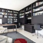 A flat screen tv sitting on top of a book shelf