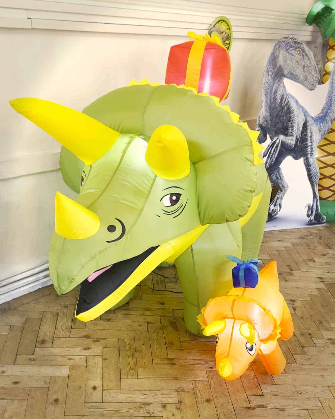 Inflatable Dinosaur Birthday Decorations – Treasure Box Parties - Childrens Party Entertainers | Surrey Hampshire and Berkshire | Treasure Box Parties Inflatable triceratops party decorations at a children’s dinosaur birthday party near Camberley