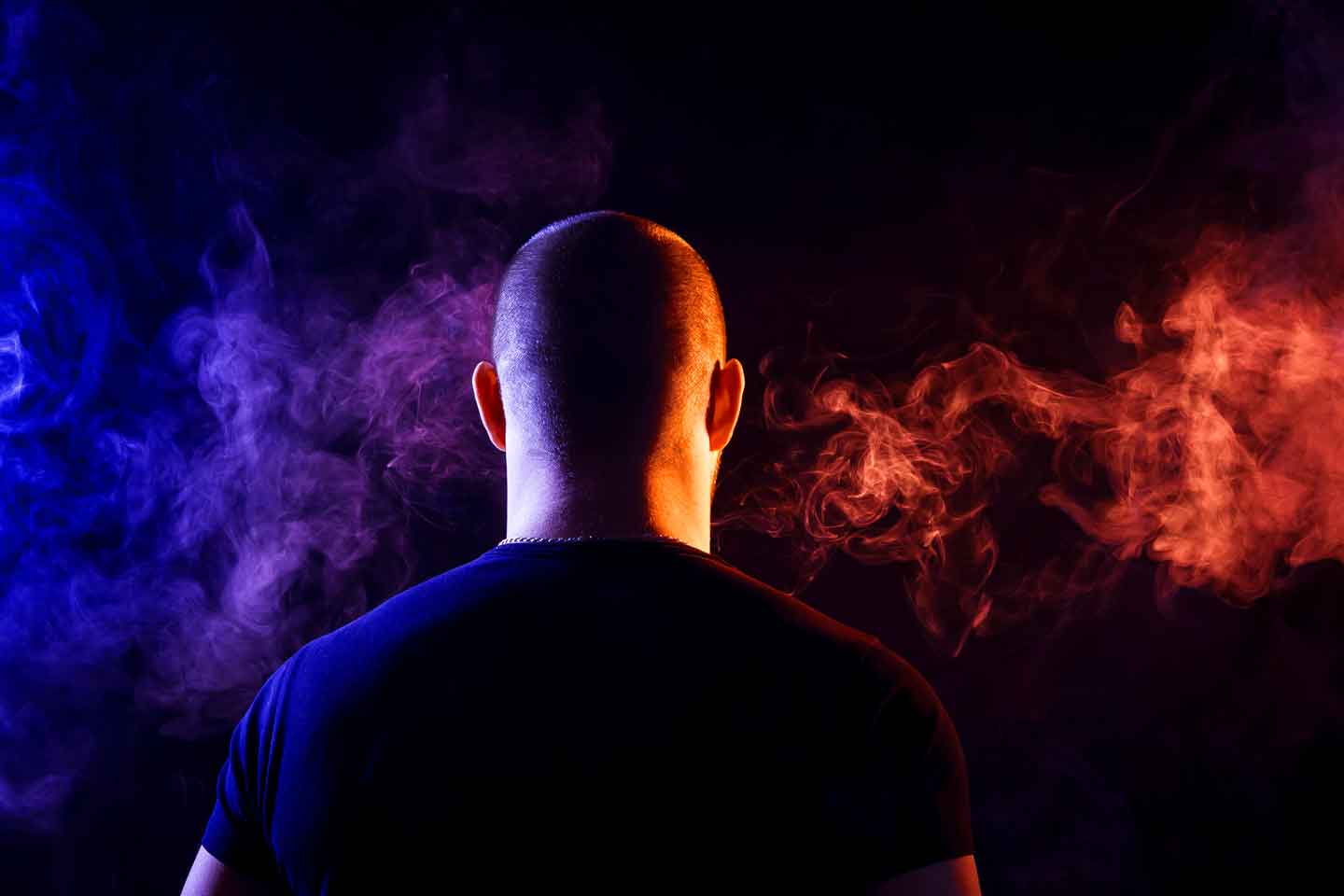 guy-vaping-e-liquid-with-colurful-smoke_7849c44f-5006-41ad-bfb2-d4a6b778b138 Guy vaping UK e-liquid with colourful smoke