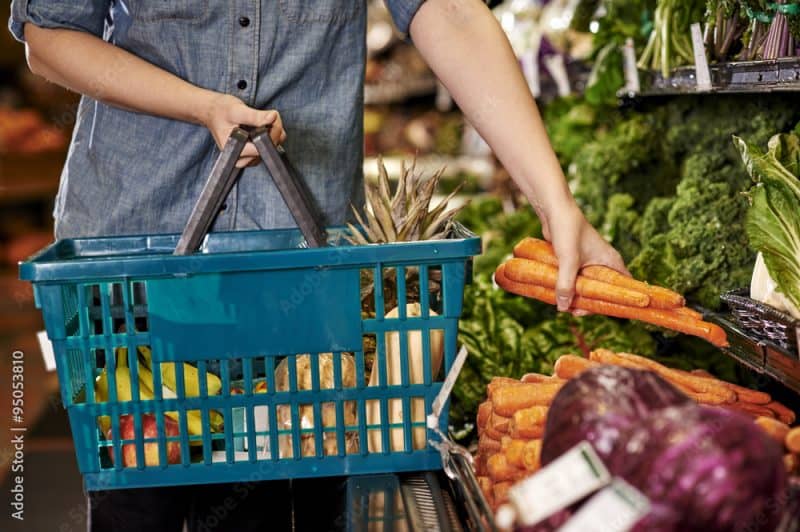 a woman shopping at a grocery store