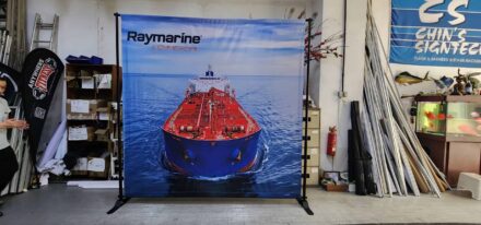 Fabric banner on telescopic backdrop stand