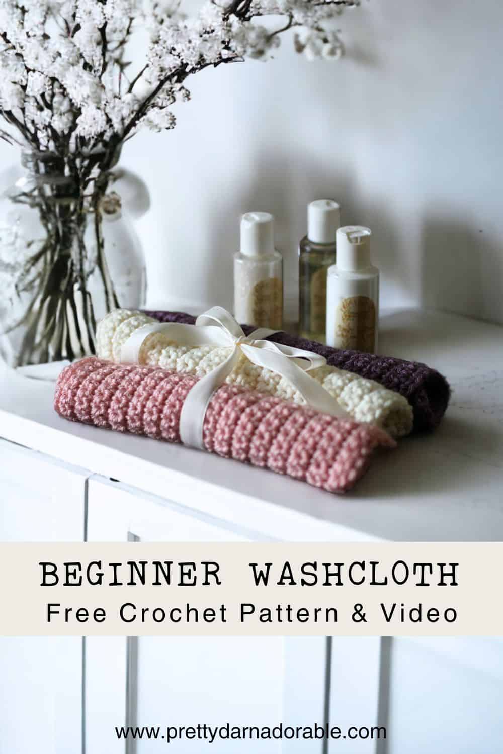 stack of crochet washcloths in purple pink and cream with a bow