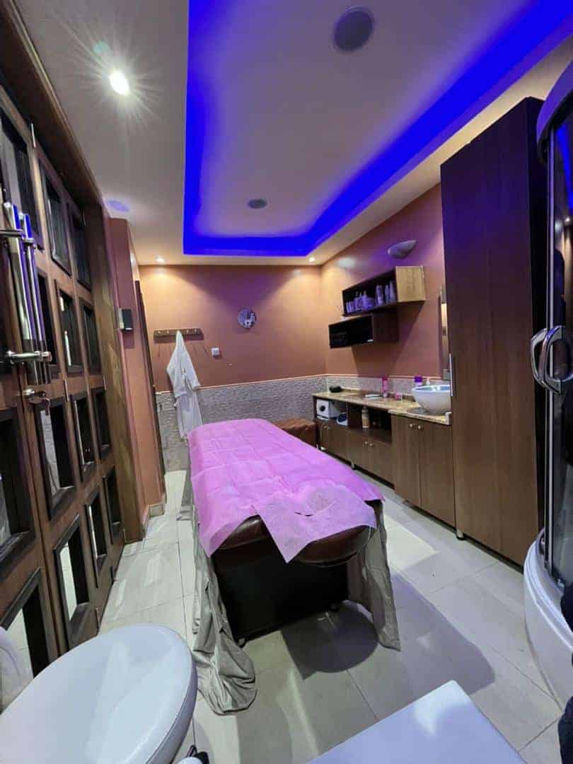 Modern spa treatment room with massage table