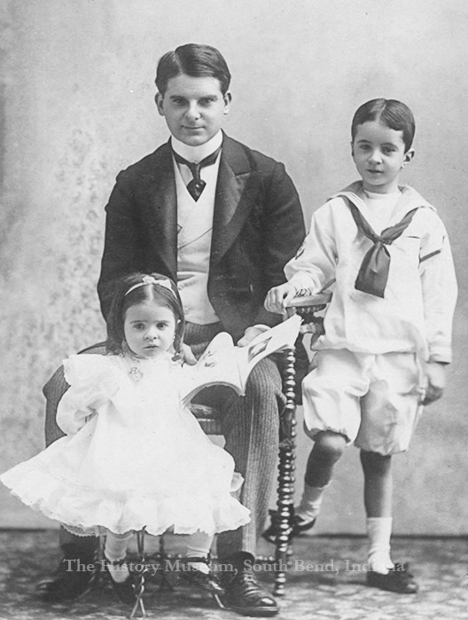 ClementJr_ph3612_WM Vintage family portrait of a father and two children, highlighting early 20th-century fashion and family life at The History Museum.