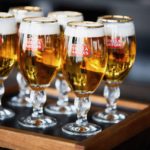 A glass of wine sitting on top of a wooden table