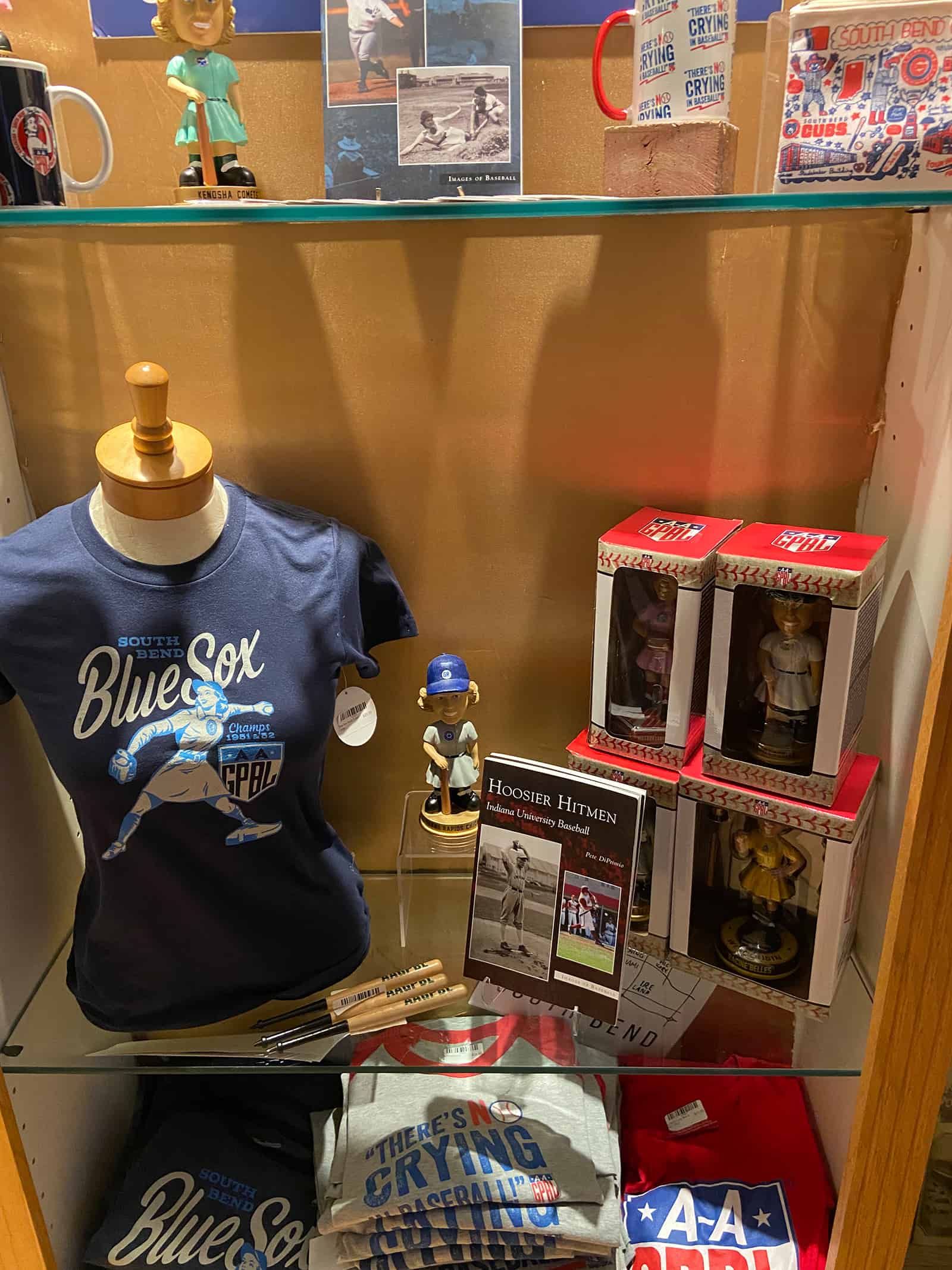 IMG_2639 Kenosha Comets vintage memorabilia display with baseball-themed merchandise and historical photos.