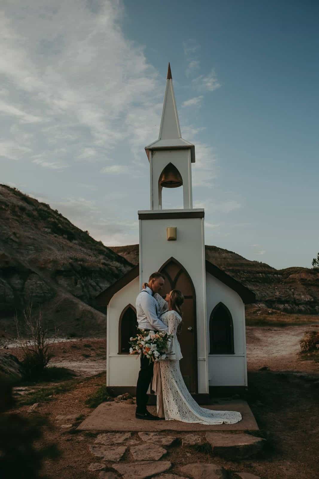 couple eloping at the little church in drumheller