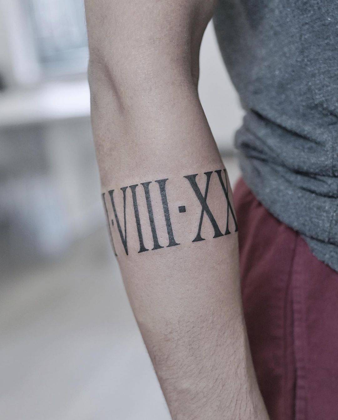 Fine Line Roman Numeral Tattoos: Subtle & Stylish