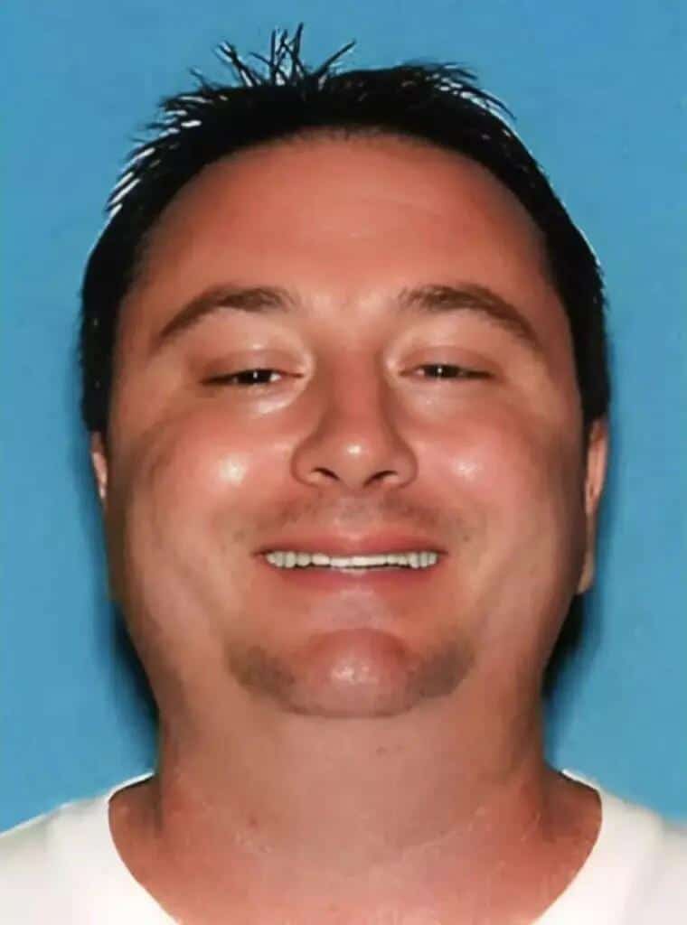 A man with short, dark hair and a goatee smiles at the camera. This may be a photo of David Lane Braff Jr., the assistant principal facing child molestation arrest charges in Los Angeles. The photo has a blue background.