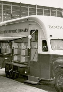 Bookmobile ph307 LL (1) Bookmobile serving as South Bend Public Library outreach vehicle in front of a modern building.