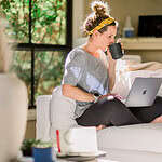 Coach Becky working on a laptop