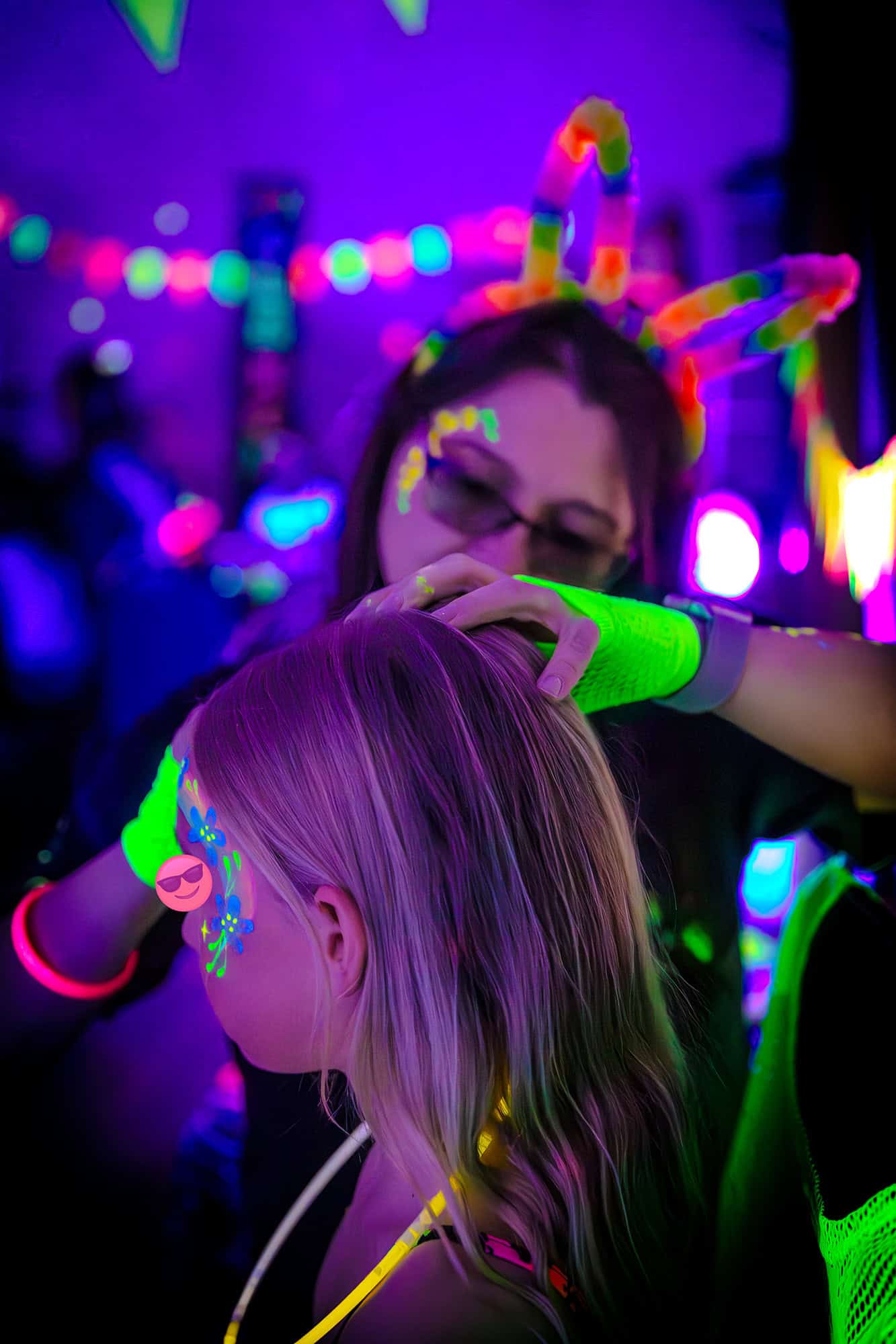 Jaime Painting Guest - Glow Disco Party Bagshot - Treasure Box Parties - Childrens Party Entertainers | Surrey Hampshire and Berkshire | Treasure Box Parties Jaime from Treasure Box Parties painting a guest's face with UV designs at Darcie’s Glow Disco birthday party in Bagshot. Offering professional UV face painting for children’s parties in Bagshot and surrounding areas.