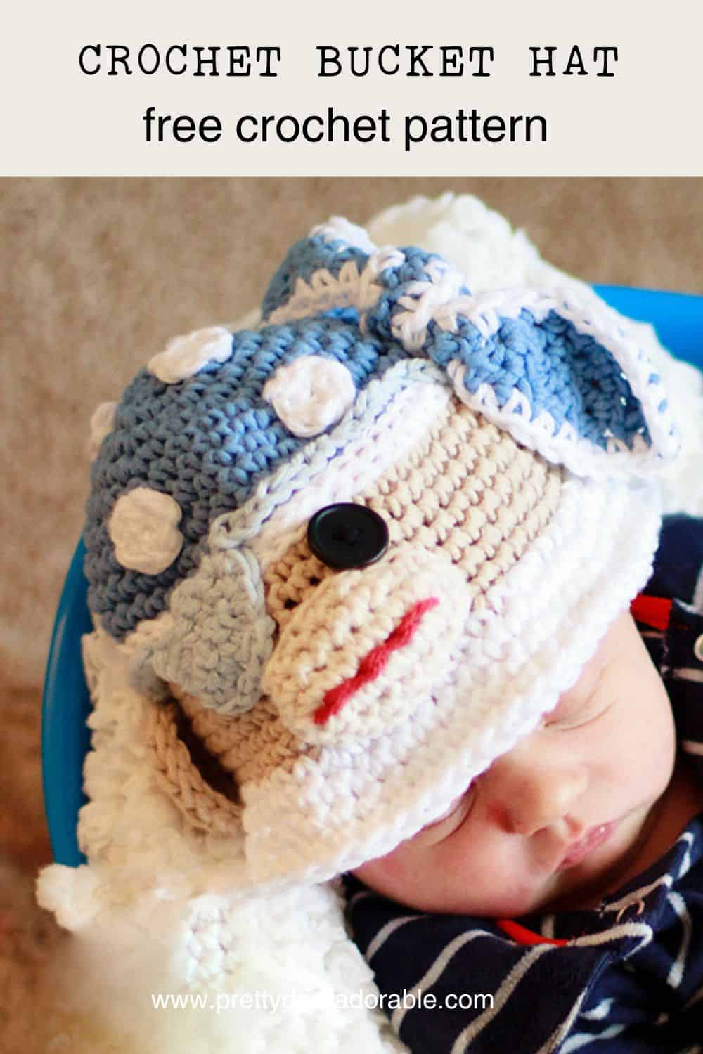 crochet bucket hat that looks like a pirate sock monkey made from red white and blue the monkey has an eye patch too. Free crochet bucket hat pattern.