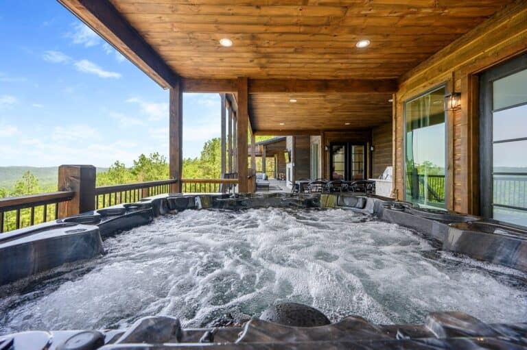 Hot tub with forest view for stargazing under clear skies at Sky Dive Cabin
