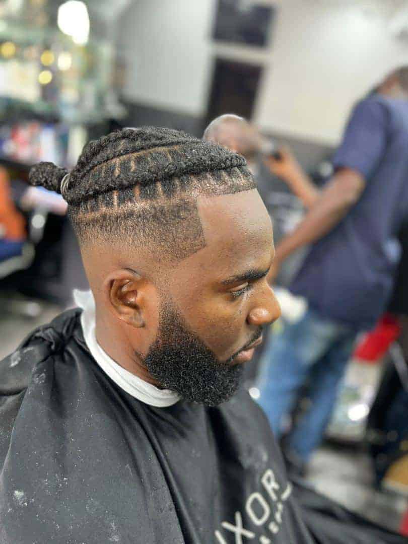 Man with braided top fade haircut in barbershop