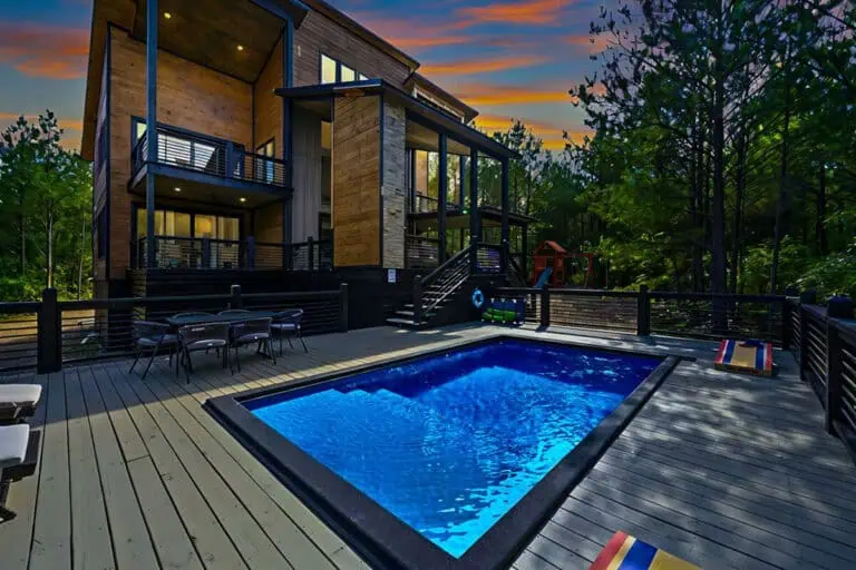 Broken bow luxury cabin rental with private pool and outdoor lounge area.