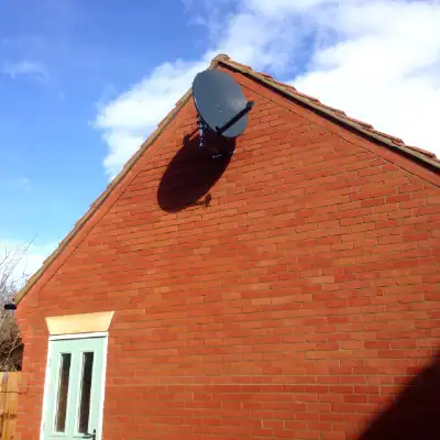 Satellite dish wall installation 2 A satellite dish installed by Digital TV Systems onto a garage gable end wall.