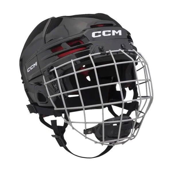 The CCM Tacks 70 is a black hockey helmet featuring a silver metal cage faceguard, ventilation slots, and an adjustable chin strap.