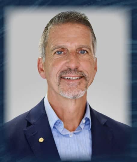 Cropped Todd Bruce Photo Senior man smiling in professional portrait at The History Museum, showcasing museum staff.