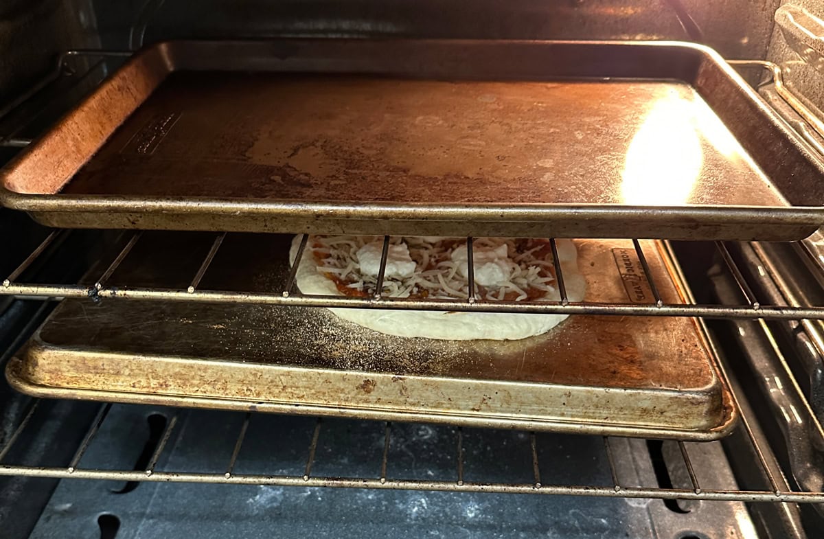 Pizza on baking sheet