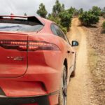 A car parked on a dirt road